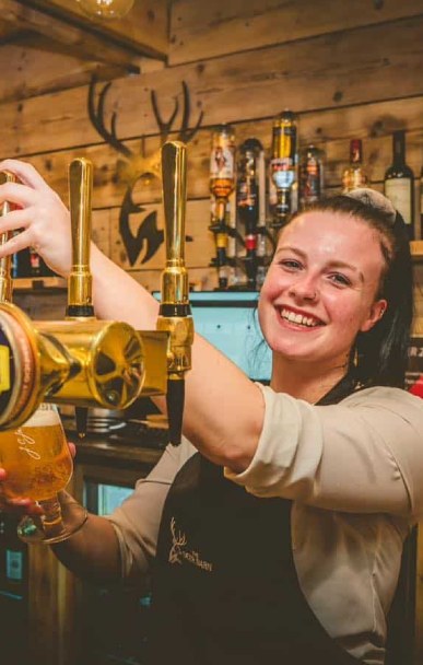 The Deer Barn - bar Pulling a pint at The Deer Barn bar