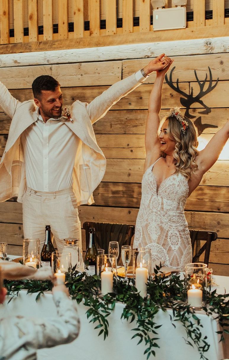 The Deer Barn - top table Newlyweds celebrating at the top table in The Deer Barn